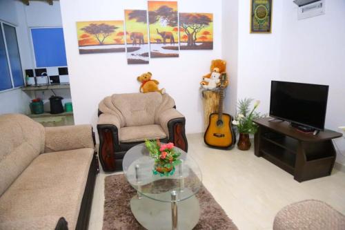 a living room with a couch and a table at White house in Nuwara Eliya