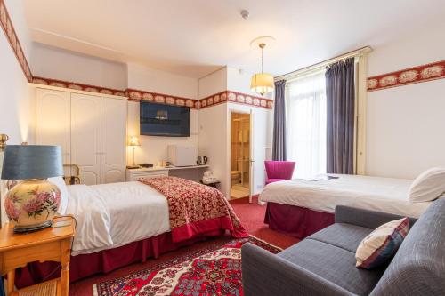 Ένα ή περισσότερα κρεβάτια σε δωμάτιο στο Hubert House
