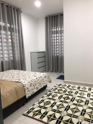 a bedroom with a bed and a dresser and curtains at Baituljannah Homestay Batu Pahat in Batu Pahat