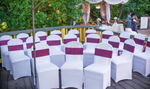 a bunch of chairs lined up for a wedding ceremony at Bay View Eco Resort & Spa in Port Antonio