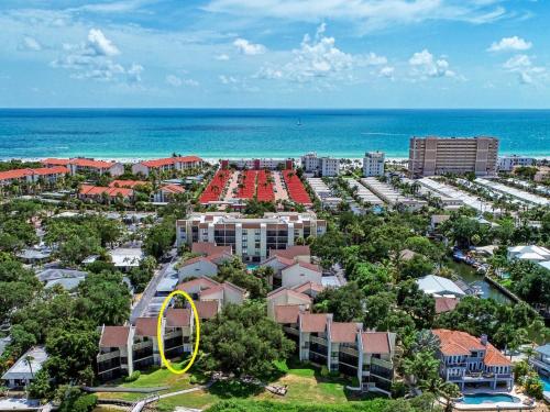 an aerial view of a resort with a yellow circle at Luxury Waterfront Views - Heated Pool - 1400sf Duplex - Minutes to the Beach in Siesta Key