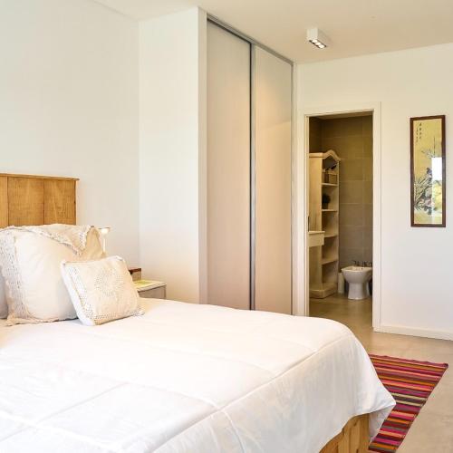 Katil atau katil-katil dalam bilik di Costa Esmeralda Departamento para 6 Personas sobre el Golf