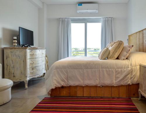 Katil atau katil-katil dalam bilik di Costa Esmeralda Departamento para 6 Personas sobre el Golf