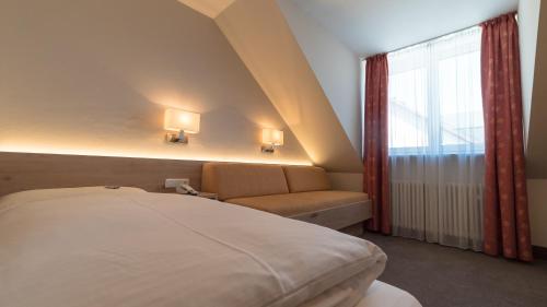 Postel nebo postele na pokoji v ubytování Hotel Lutter