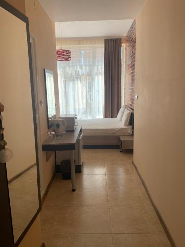 a room with a bedroom with a bed and a mirror at Agora Studios in Plovdiv