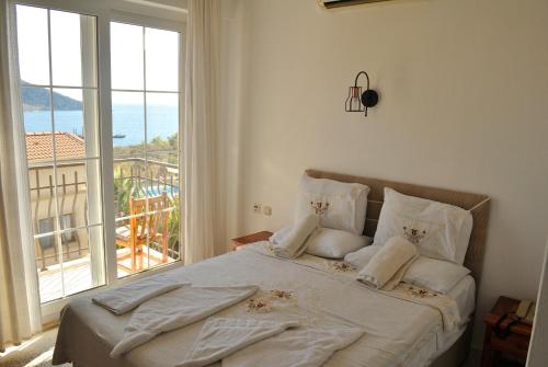 Säng eller sängar i ett rum på Hotel Dionysia