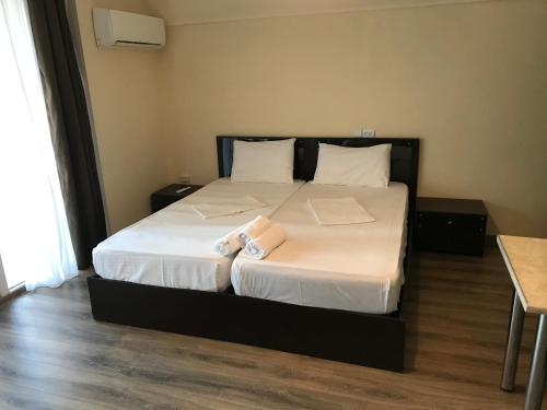 Кровать или кровати в номере Apartment In Batumi MGZAVREBI