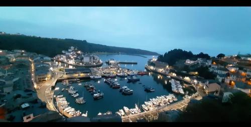 an aerial view of a marina with boats in the water at ATICO LA PEÑA in Luarca