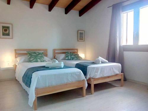Posteľ alebo postele v izbe v ubytovaní Finca Cas Canar