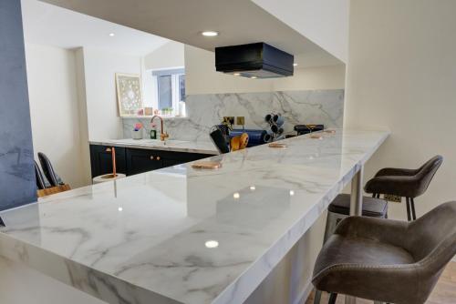 a kitchen with a large white marble counter top at 23 Tanners Yard in Kendal