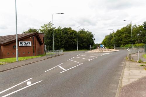 an empty road in front of a building at Livingston Lodge Hotel in Livingston