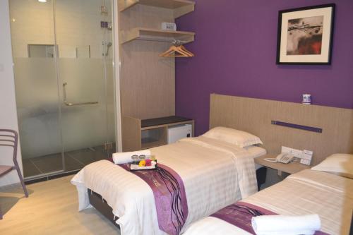 Letto o letti in una camera di Ashley Boutique Hotel