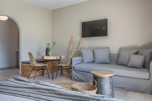 a living room with a couch and a table at Avithos Resort Hotel in Svoronata