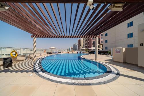 a swimming pool on the roof of a building at Star Metro Deira Hotel Apartments in Dubai