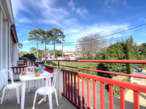 a balcony with a table and chairs on it at Apartment Du lac by Interhome in Soorts-Hossegor
