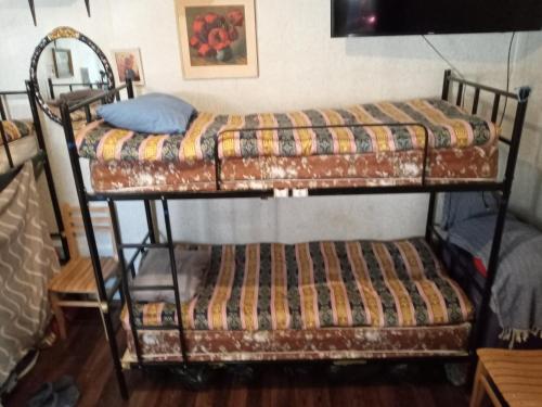 two bunk beds sitting on top of a room at My Hostel and Cooking House! in Tbilisi City