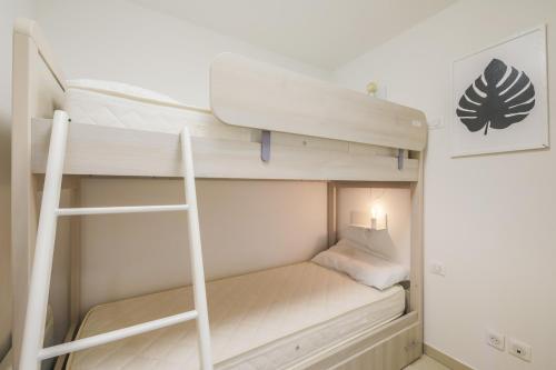 Ένα ή περισσότερα κρεβάτια σε δωμάτιο στο Residence Les Melezes - maeva Home