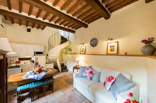 
a living room filled with furniture and decor at Casa Amorino- Together Tuscany in Cortona
