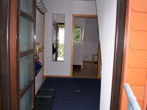 a hallway with a door leading to a room at Das Steghaus in Gräfenberg