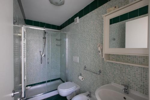 a bathroom with a toilet and a shower and a sink at Antica Dimora Isernia in Isernia