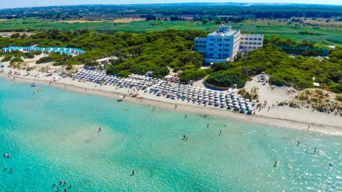 an aerial view of a beach with people in the water at Ecoresort Le Sirene - Caroli Hotels in Gallipoli