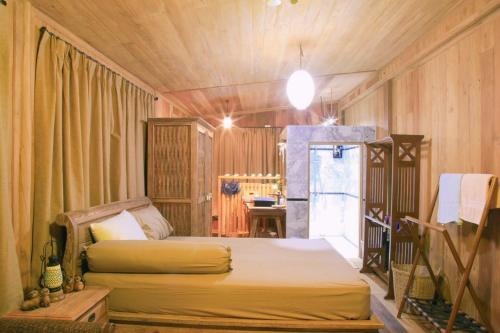 A bed or beds in a room at The Canale Boutique Stay Koh Kood