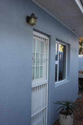 a white door with a window on a house at 25 on Fitzpatrick in Parow