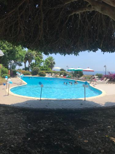 a swimming pool at the resort at Agriturismo Serra San Biagio in Calatabiano