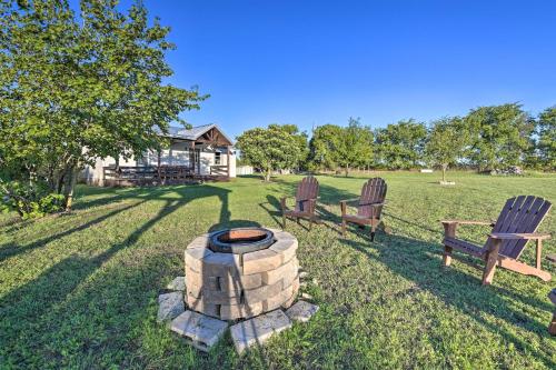 two chairs and a fire pit in a yard at Day Trip to Waco and Temple House on Cattle Farm in Lorena