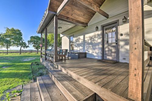 a front porch of a house with a wooden deck at Day Trip to Waco and Temple House on Cattle Farm in Lorena