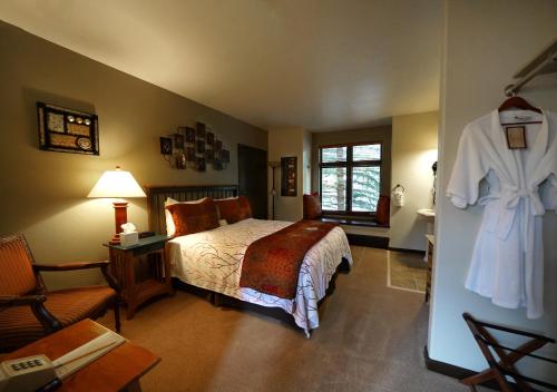 Ένα ή περισσότερα κρεβάτια σε δωμάτιο στο Frisco Inn on Galena
