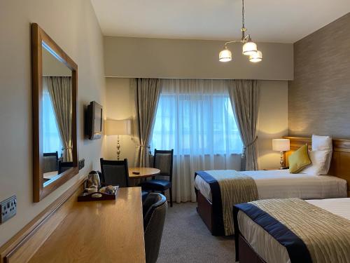 Postel nebo postele na pokoji v ubytování An Grianan Hotel