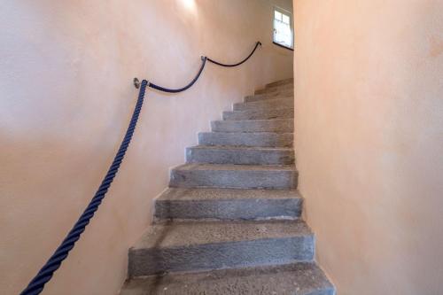 a flight of stairs with a rope leading up them at Residence La Torre con private park in Trieste