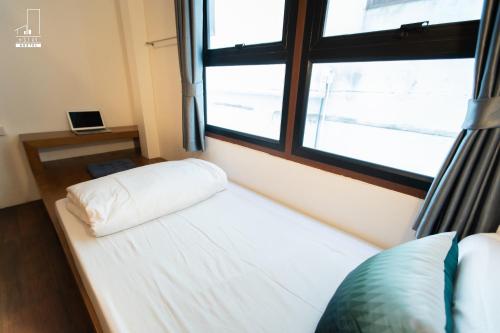 Ein Bett oder Betten in einem Zimmer der Unterkunft Mystay Hostel Nan