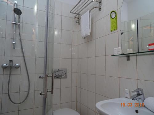 a bathroom with a shower and a toilet and a sink at Villa BB in Banino