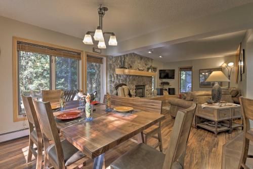 a dining room and living room with a table and chairs at Creekside Frisco Condo with Views and Pool Access! in Frisco