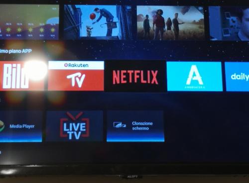 a television screen with several different logos on it at Domus Leone Tre in Naples