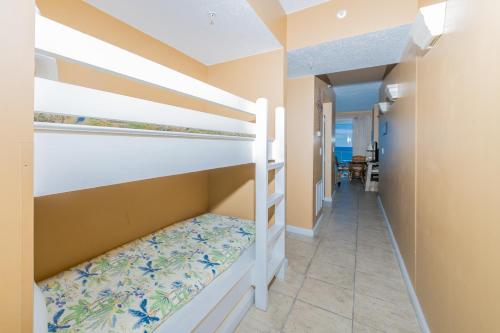 a bunk bed in a room with a corridor at Windemere Condominiums in Perdido Key