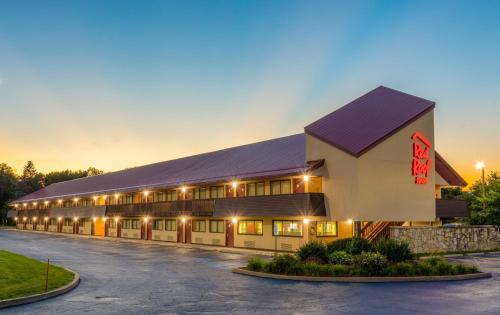 a large building with a lot of windows at Red Roof Inn Kalamazoo East – Expo Center in Kalamazoo