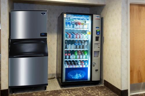 a vending machine filled with bottles of soda at Red Roof Inn Clifton Park in Clifton Park