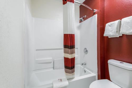 a bathroom with a toilet and a shower at Red Roof Inn Gallup in Gallup