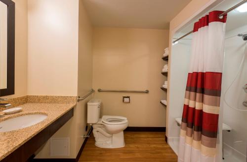 A bathroom at Red Roof Inn PLUS+ & Suites Malone