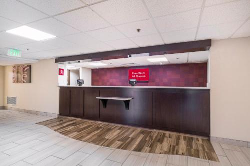 a waiting room with a bench on the wall at Red Roof Inn Knoxville Central – Papermill Road in Knoxville