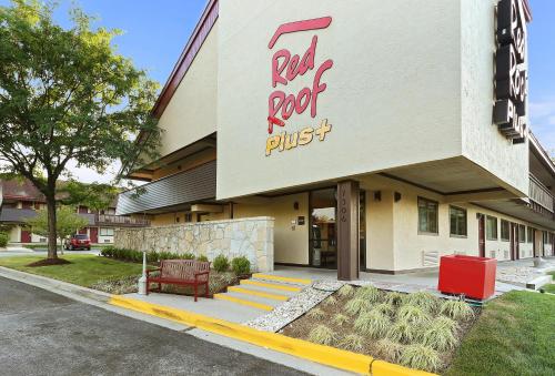 a building with a red roof plus sign on it at Red Roof Inn PLUS+ Baltimore - Washington DC/BWI South in Hanover