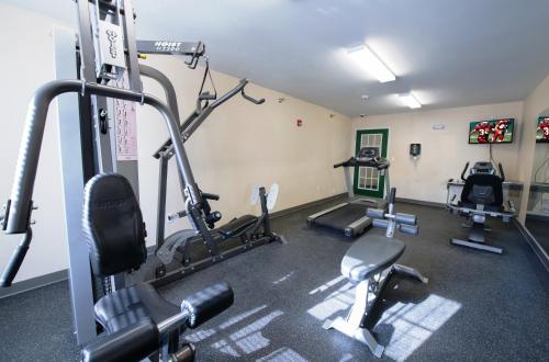 a gym with several tread machines in a room at Red Roof Inn & Suites Dickinson in Dickinson