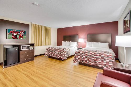 a hotel room with two beds and a tv at Red Roof Inn Franklin, KY in Franklin