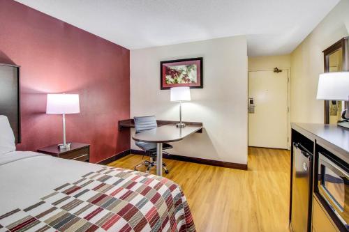 a hotel room with a bed and a desk at Red Roof Inn Franklin, KY in Franklin