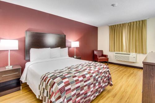 a hotel room with a bed and a chair at Red Roof Inn Franklin, KY in Franklin