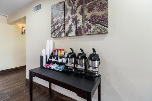 a room with a table with wine bottles on it at Red Roof Inn Murfreesboro in Murfreesboro