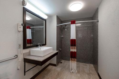 a bathroom with a sink and a shower at Red Roof Inn Kenly - I-95 in Kenly